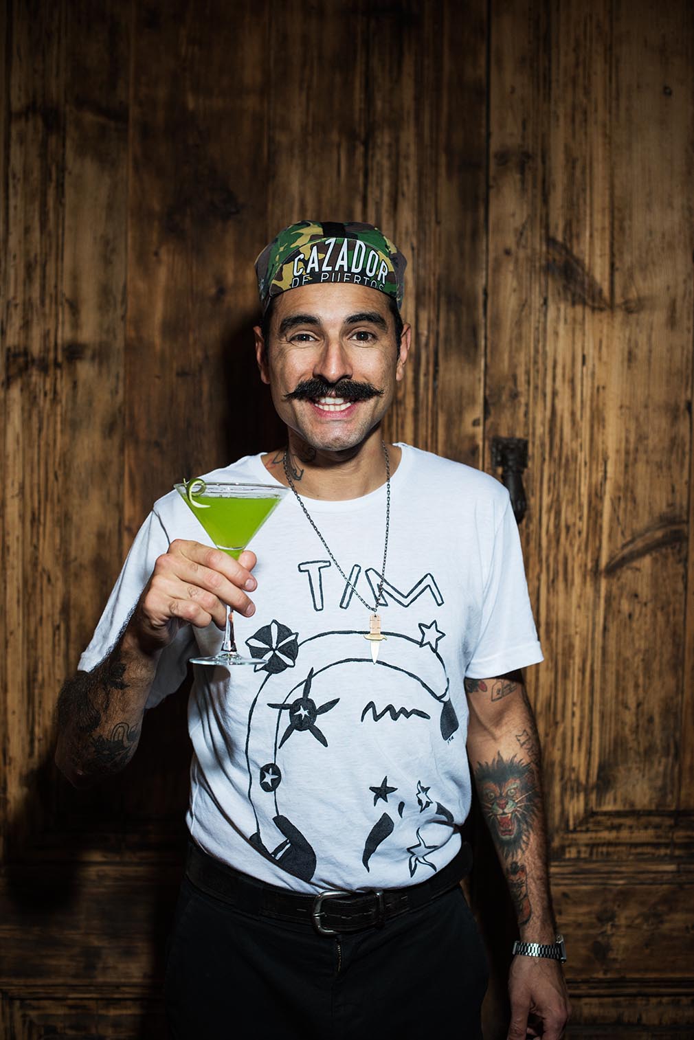 A bartender holding a cocktail